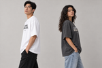 Concept mockup — All That Stress. Break Even. — Tee, side view on two models.