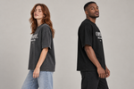 Concept mockup — Compré. Perdón a Todos. — Tee, side view on two models.
