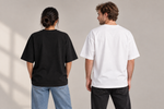 Concept mockup — Se Me Olvidó la Noticia — Tee, back view on two models.