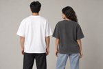Concept mockup — Me Sacó el Stop — Tee, back view on two models.