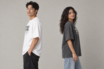 Concept mockup — Me Sacó el Stop — Tee, side view on two models.