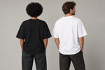 Concept mockup — Stopped Out. Then It Flew. — Tee, back view on two models.