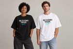 Concept mockup — Mi Último Trade — Embusteee — Tee on two models.